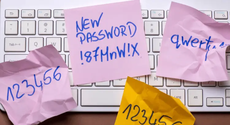 Passwords on four sticky notes on a keyboard