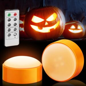 Battery-operated LED pumpkin lights with remote control for Halloween decor.